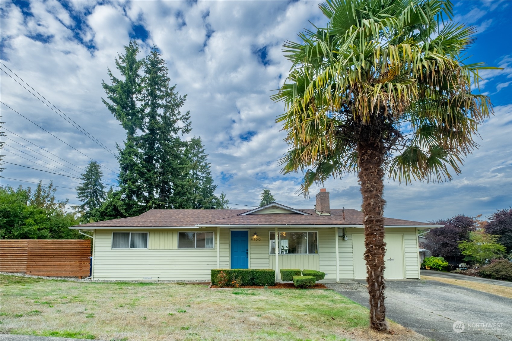 4100 Northeast 11th Street Renton, WA 98059 - Photo 21 of 27 a front view of a house with a garden