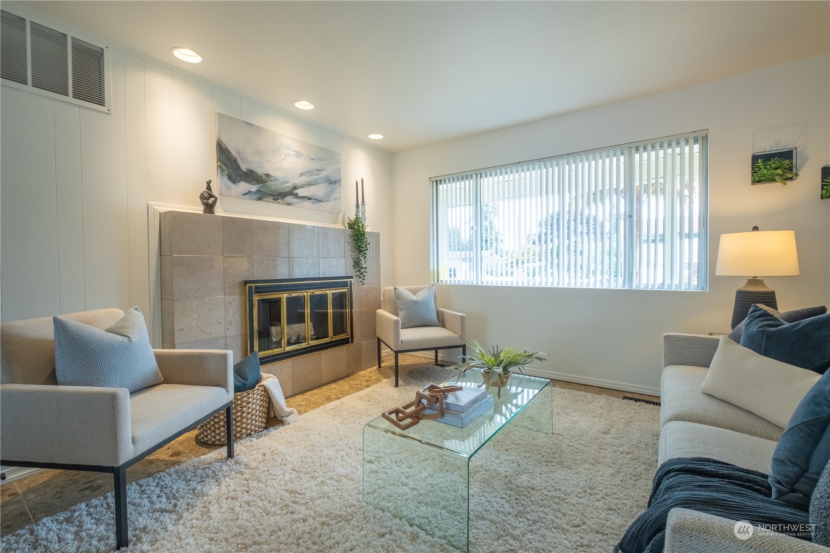4100 Northeast 11th Street Renton, WA 98059 - Photo 3 of 27 a living room with furniture and a fireplace