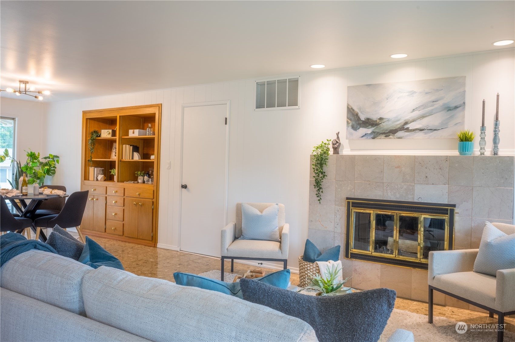 4100 Northeast 11th Street Renton, WA 98059 - Photo 4 of 27 a living room with furniture and a fireplace