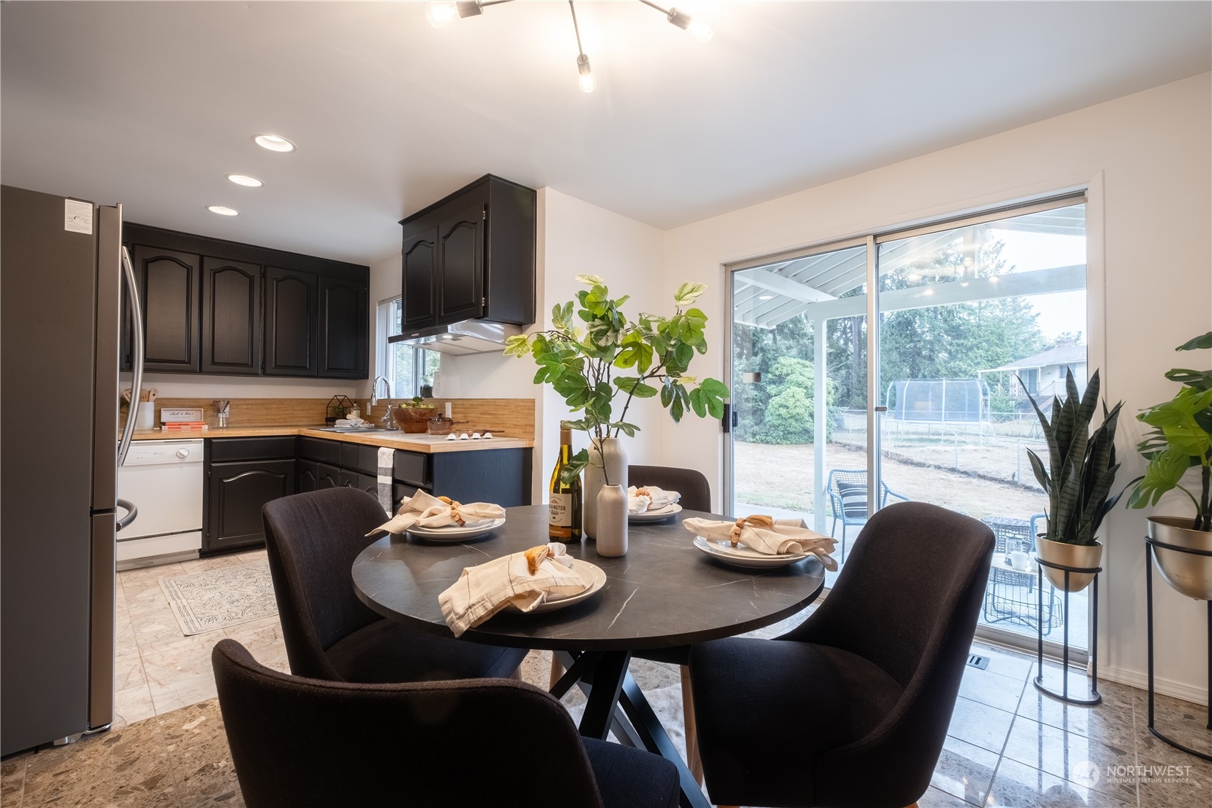 4100 Northeast 11th Street Renton, WA 98059 - Photo 6 of 27 a view of a dining room with furniture window and outside view