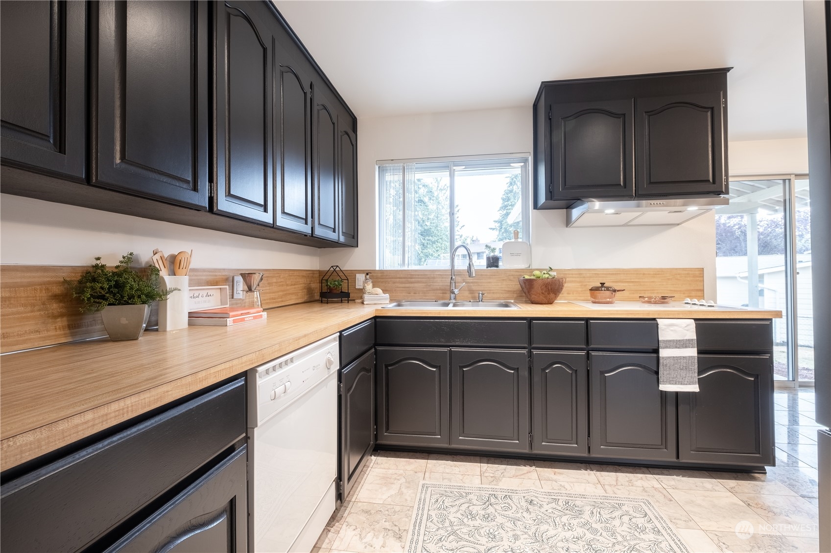 4100 Northeast 11th Street Renton, WA 98059 - Photo 7 of 27 a kitchen with stainless steel appliances granite countertop a sink stove and microwave