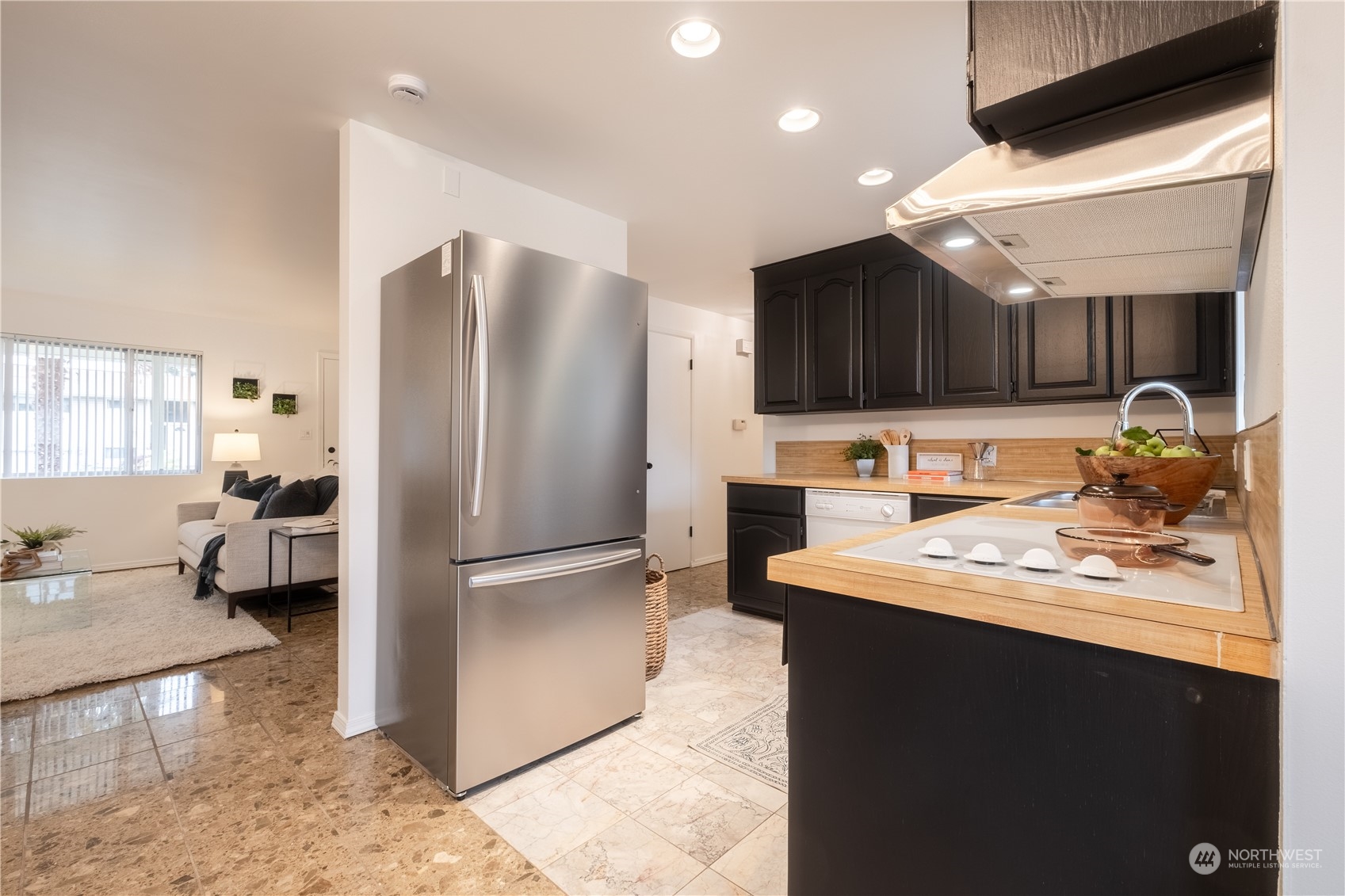 4100 Northeast 11th Street Renton, WA 98059 - Photo 8 of 27 a kitchen with stainless steel appliances granite countertop a refrigerator and a sink