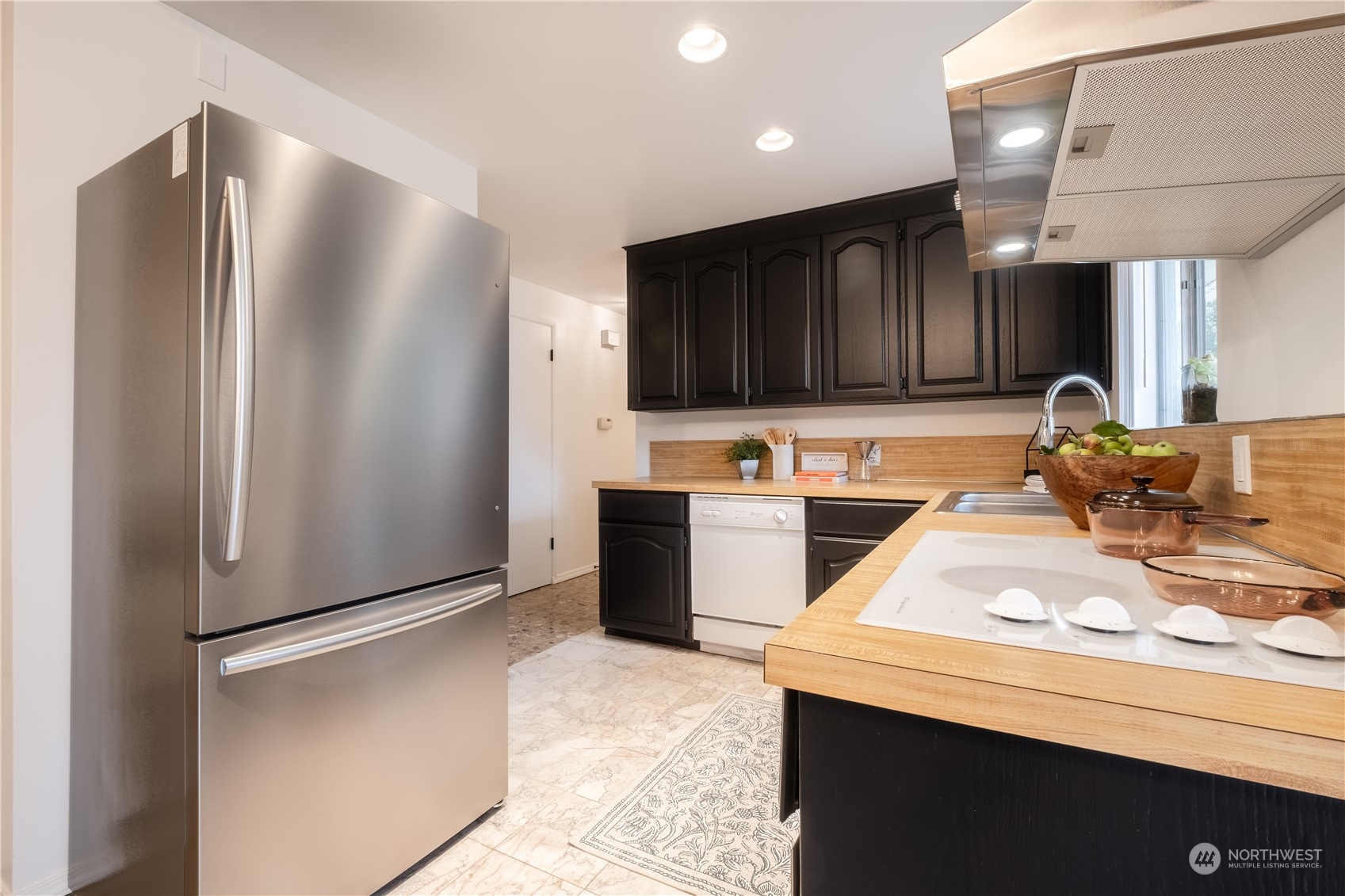 4100 Northeast 11th Street Renton, WA 98059 - Photo 9 of 27 a kitchen with stainless steel appliances granite countertop a refrigerator a sink and a stove
