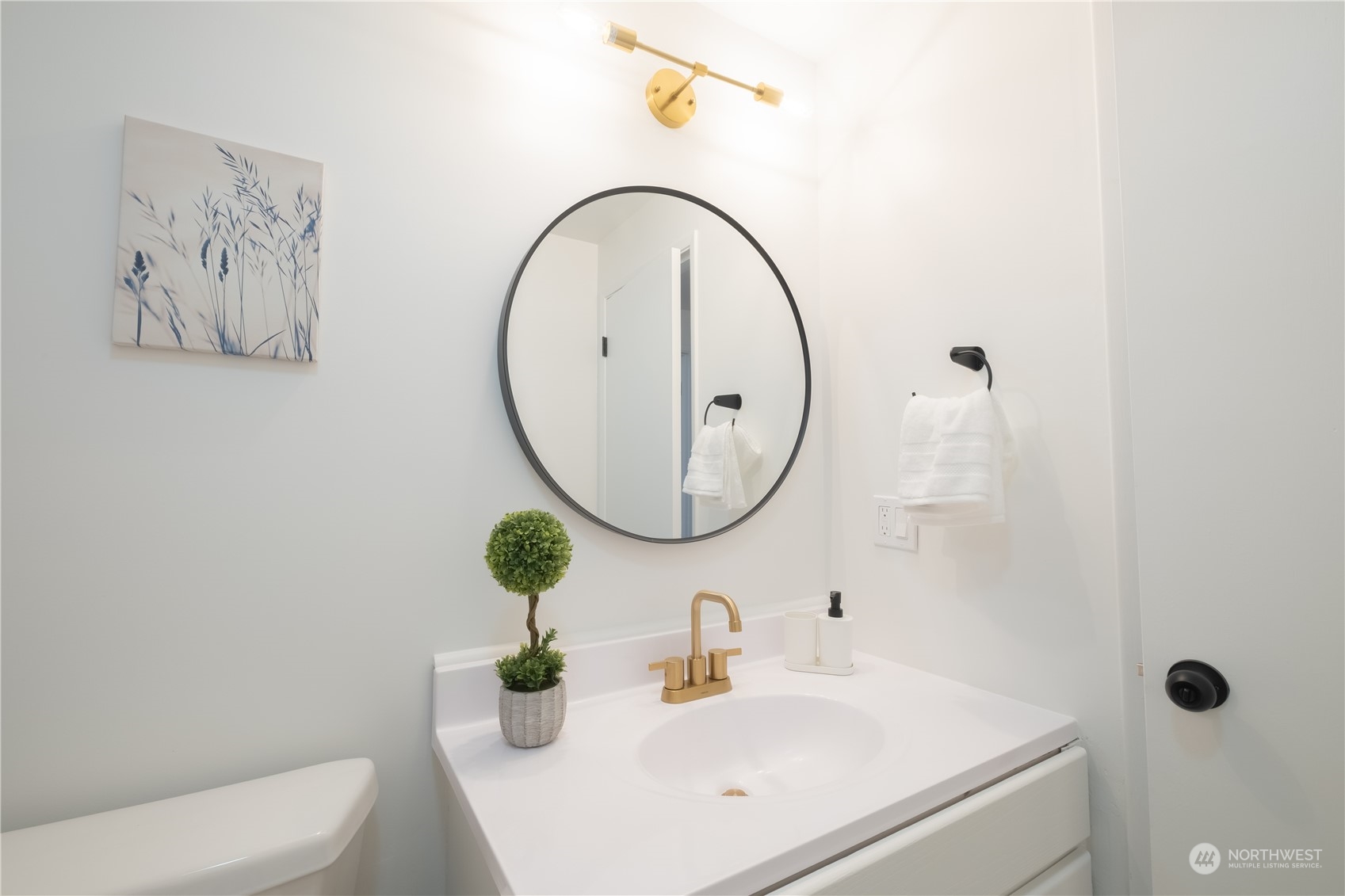 4100 Northeast 11th Street Renton, WA 98059 - Photo 10 of 27 a bathroom with a sink mirror and toilet