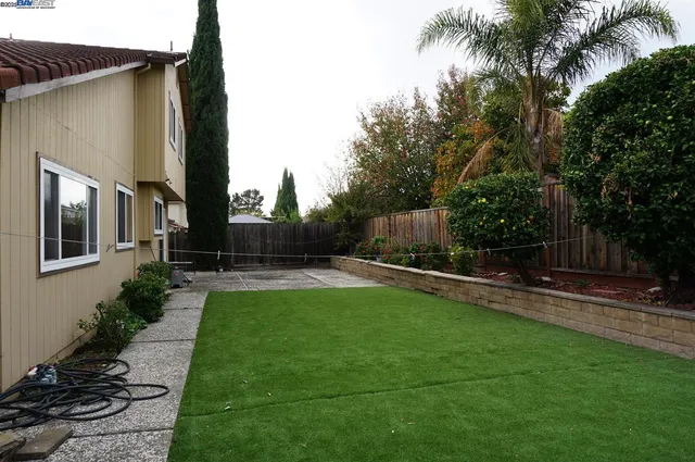 a house view with a garden space