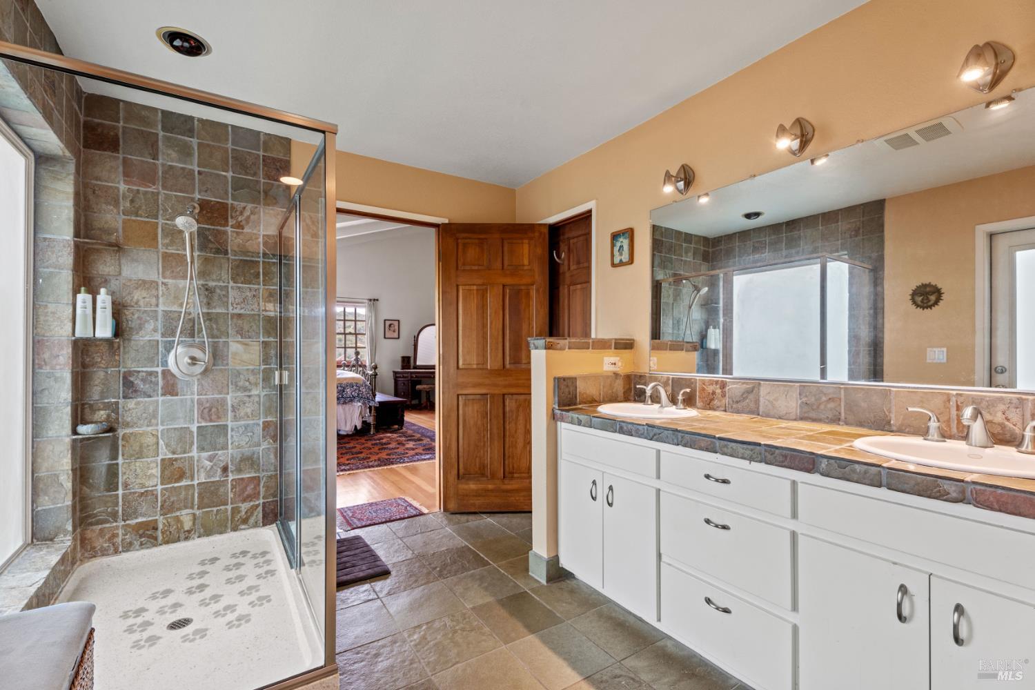 3760 King Ranch Road Ukiah, CA 95482 - Photo 18 of 44 a bathroom with a double vanity sink and a mirror