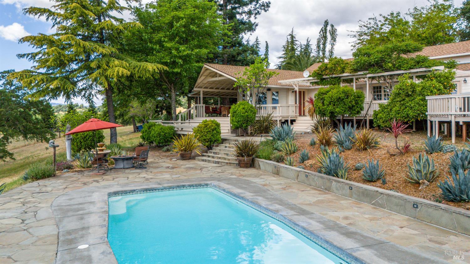 3760 King Ranch Road Ukiah, CA 95482 - Photo 37 of 44 a front view of a house with garden