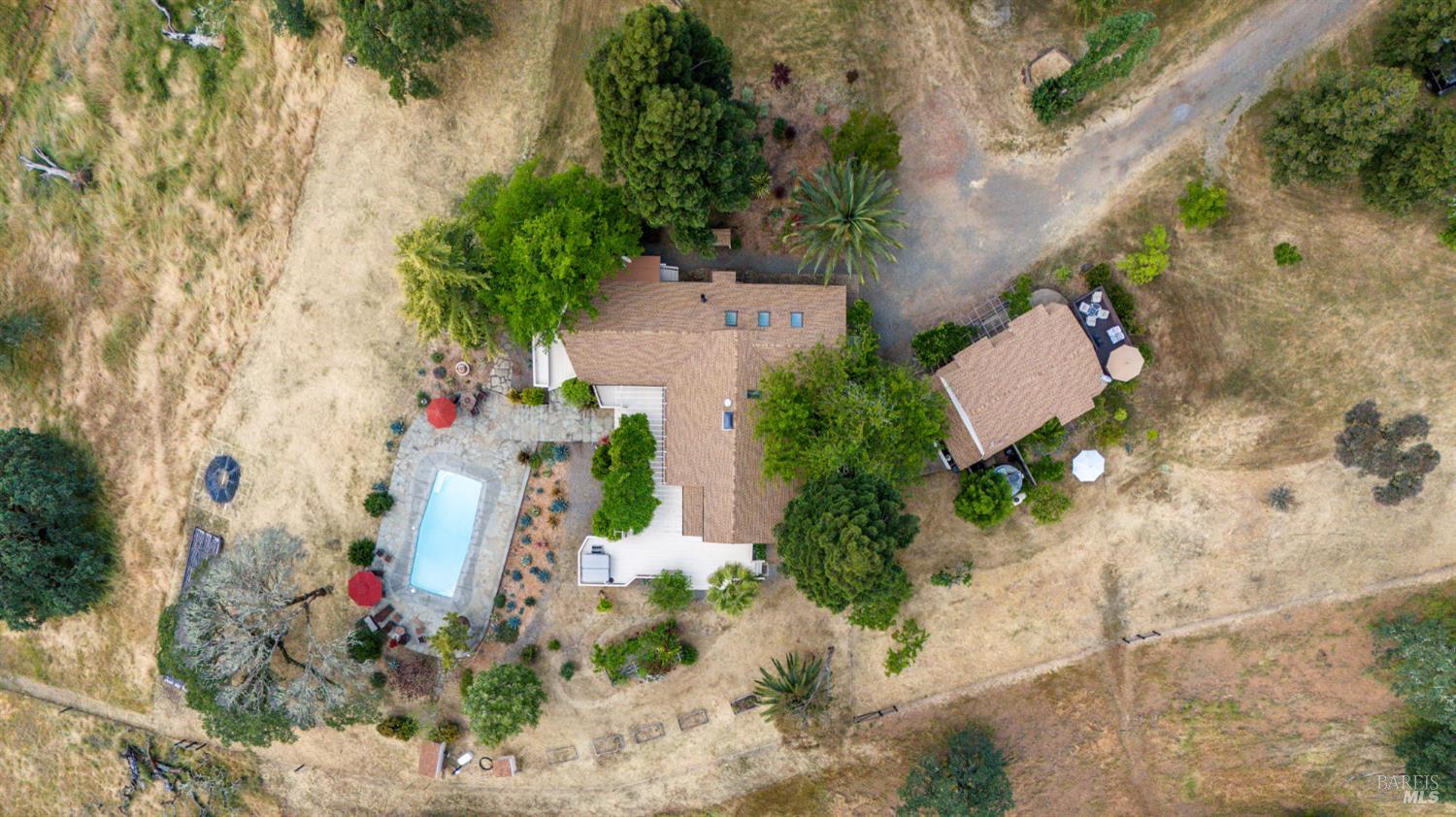 3760 King Ranch Road Ukiah, CA 95482 - Photo 38 of 44 an aerial view of a house with a yard and large trees