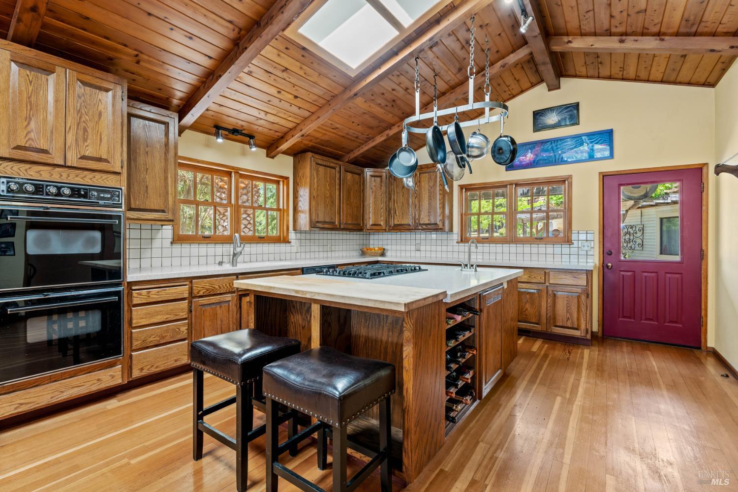 3760 King Ranch Road Ukiah, CA 95482 - Photo 7 of 44 a kitchen with stainless steel appliances granite countertop a stove a sink and a microwave