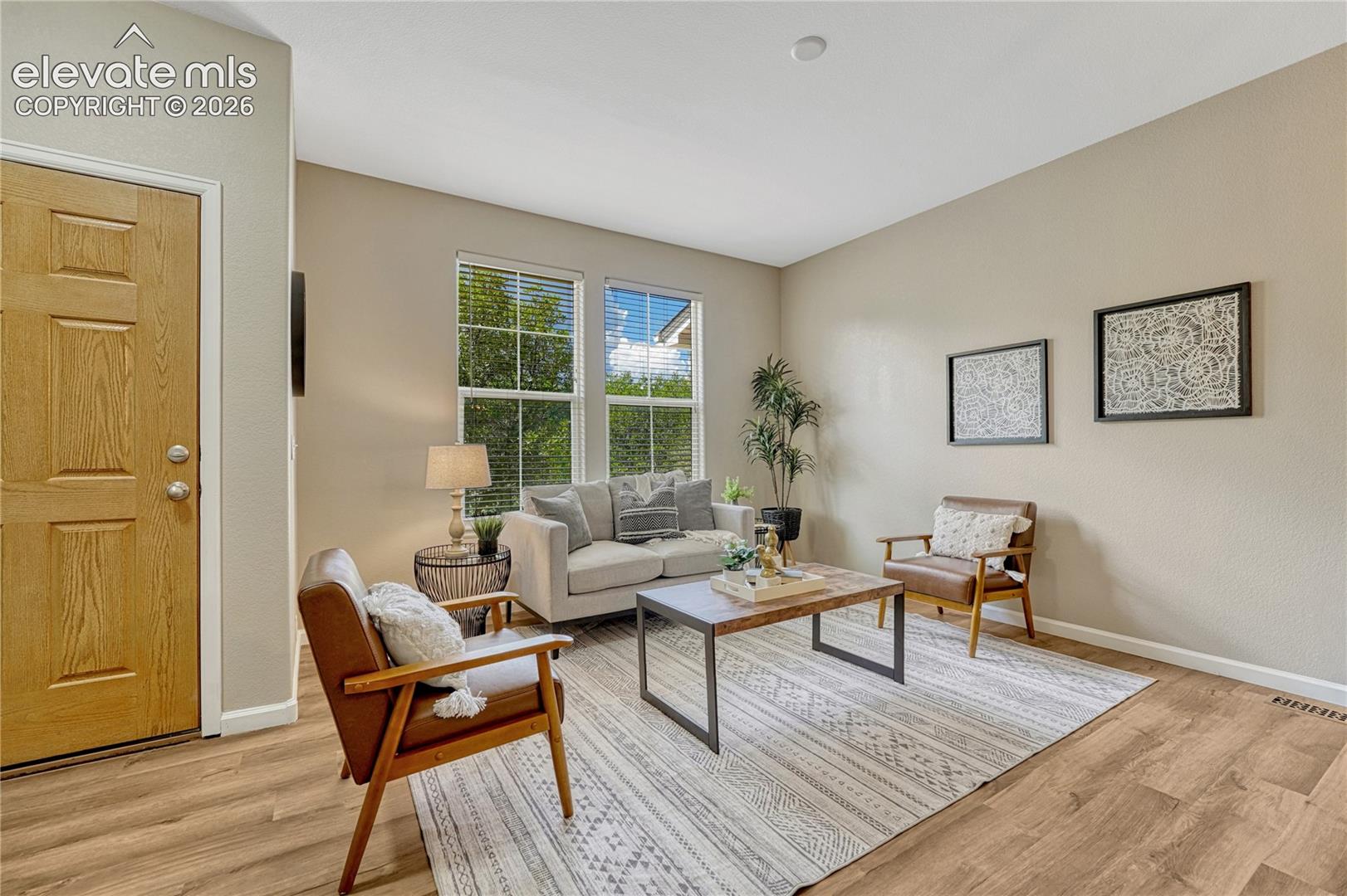4147 Diamond Ridge View Colorado Springs, CO 80918 - Photo 6 of 42 The main living room features brand-new wood-style flooring and a bright, airy atmosphere that instantly feels like home