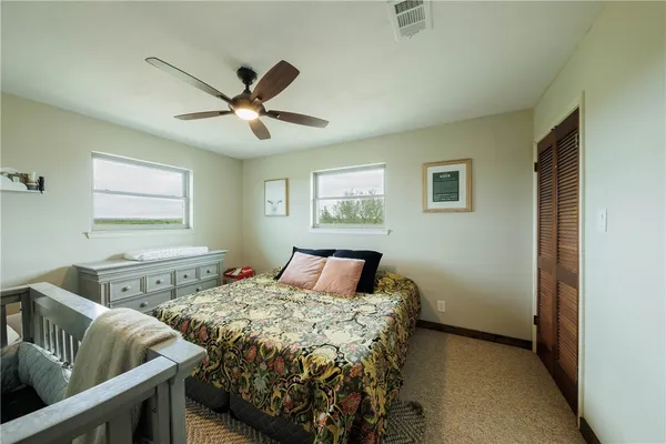 a spacious bathroom with a sink double vanity and a toilet