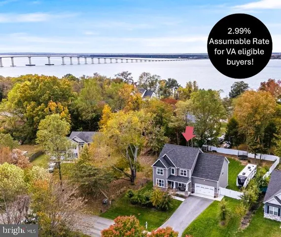 a view of swimming pool with a garden and seating area