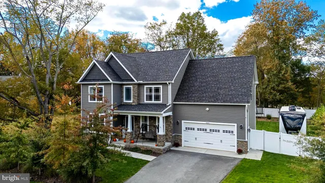 a aerial view of a house with a yard