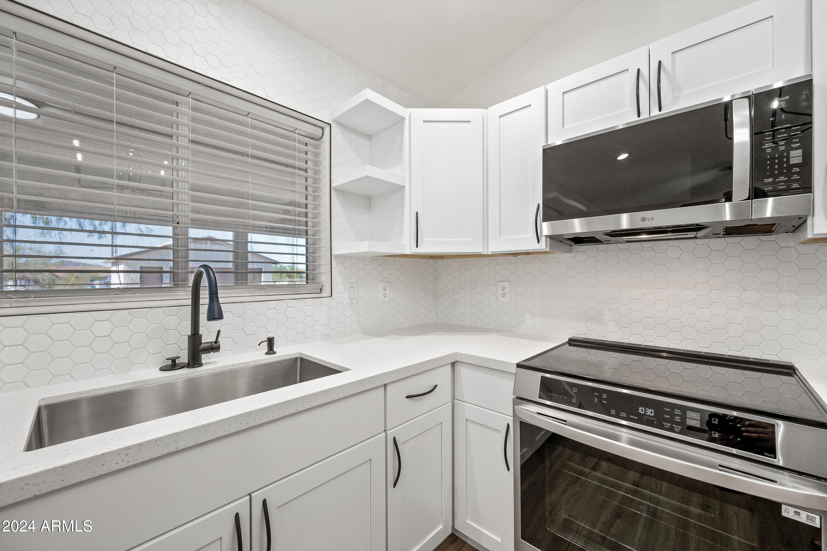 1739 West Joy Ranch Road Phoenix, AZ 85086 - Photo 41 of 65 Interior - kitchen sink and stove