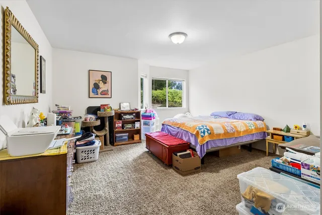 a bedroom with a bed and a couch