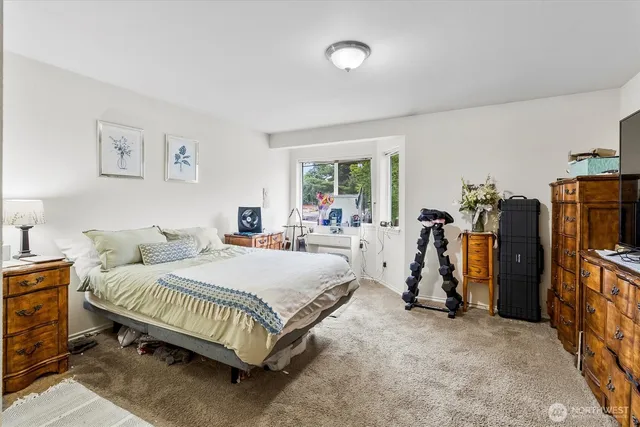 a bedroom with a bed and a walk in closet