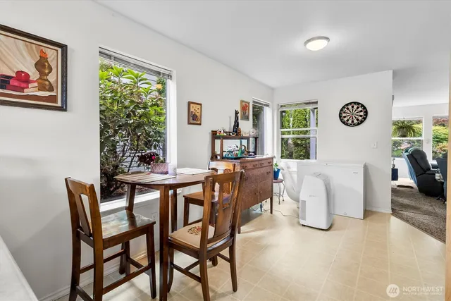 a dining room with furniture and window
