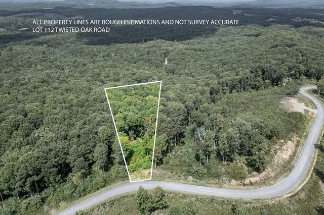 a view of house with a yard