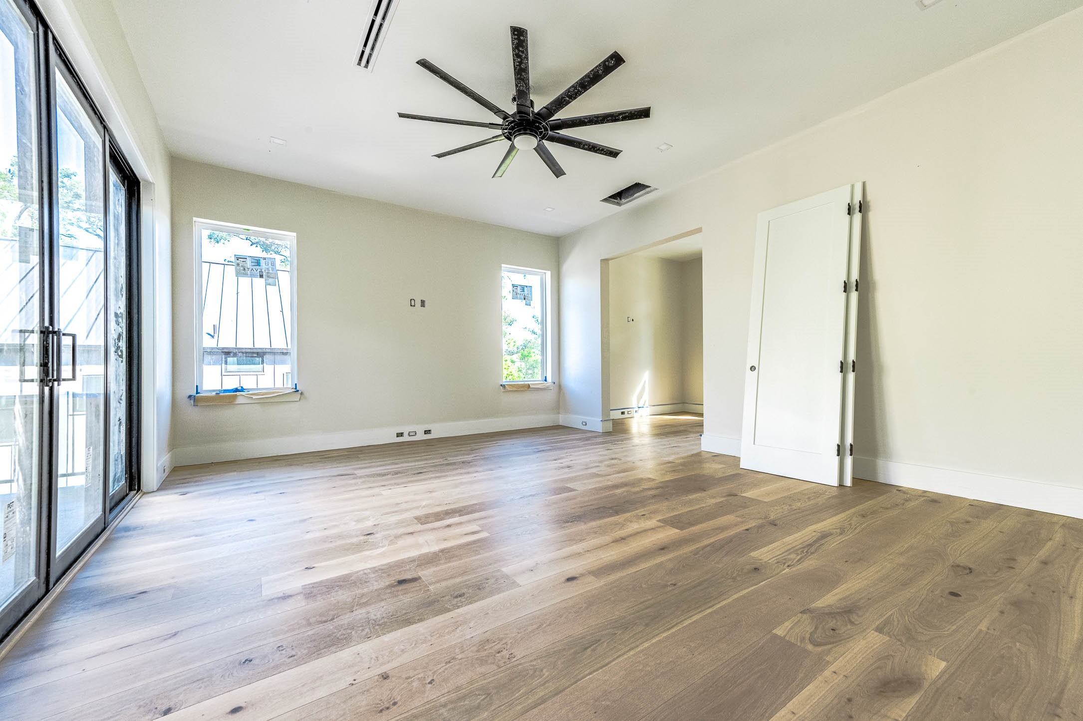 408 West 30th Street Houston, TX 77018 - Photo 24 of 27 a view of an empty room with window and wooden floor