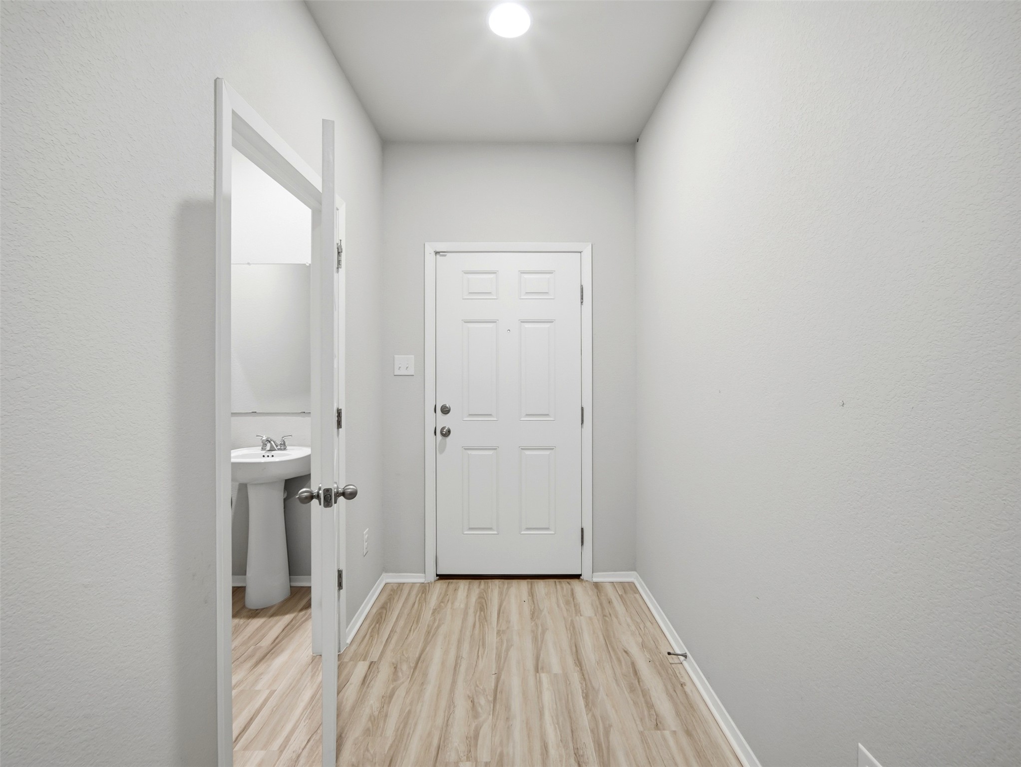 60 Bent Trl Lane Georgetown, TX 78628 - Photo 5 of 40 A welcoming entry foyer features durable laminate flooring and a convenient half-bath.