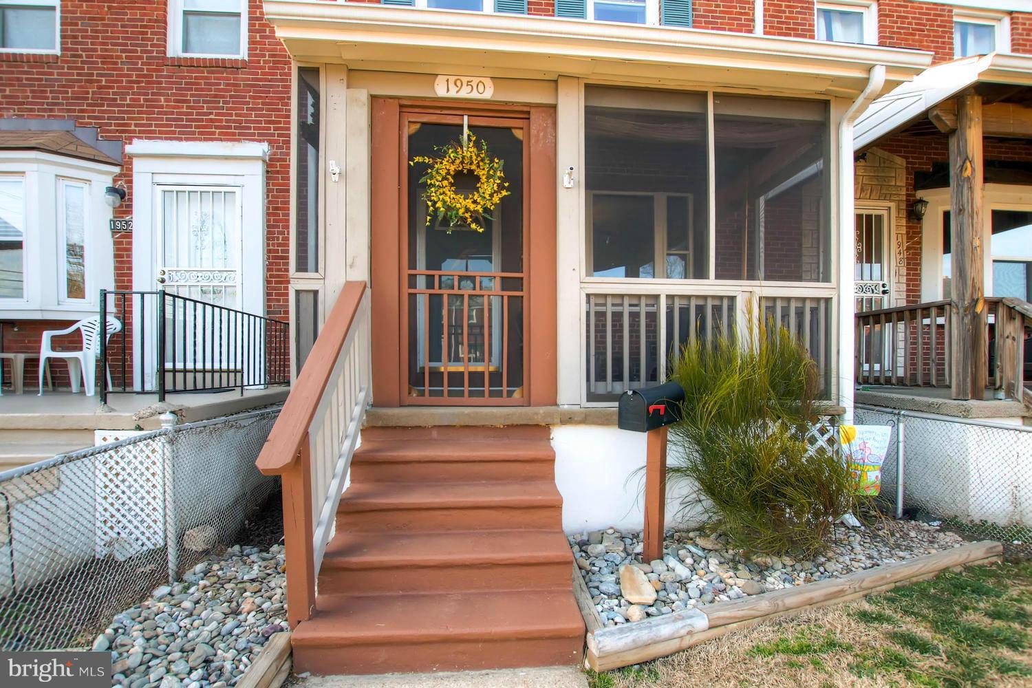 1950 Quentin Road Baltimore, MD 21222 - Photo 3 of 27 a front view of a house with a porch