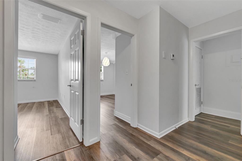 4216 Lake Underhill Road, Unit 6A28 Orlando, FL 32803 - Photo 11 of 18 a view of a hallway with wooden floor