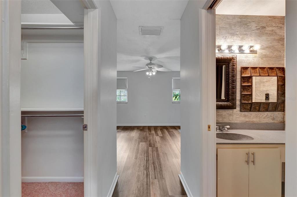4216 Lake Underhill Road, Unit 6A28 Orlando, FL 32803 - Photo 12 of 18 a view of a hallway with granite countertop a refrigerator