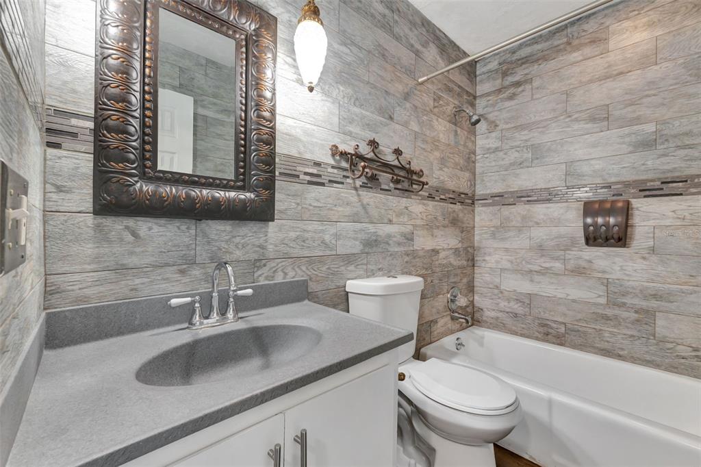 4216 Lake Underhill Road, Unit 6A28 Orlando, FL 32803 - Photo 14 of 18 a bathroom with a sink and a mirror