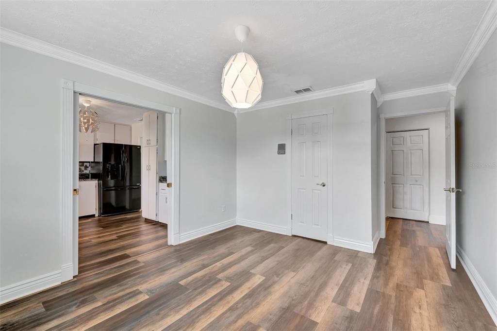 4216 Lake Underhill Road, Unit 6A28 Orlando, FL 32803 - Photo 8 of 18 a view of empty room with wooden floor