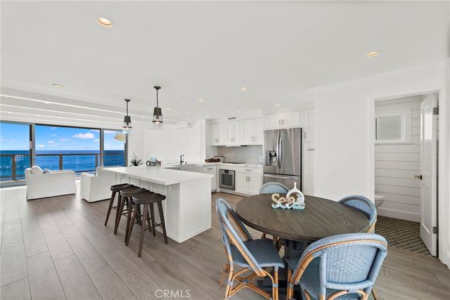 a kitchen with a white cabinets and white appliances