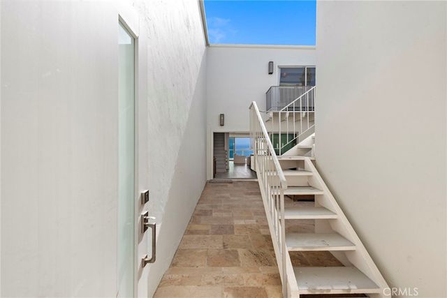 a living room with furniture gym equipment and a rug