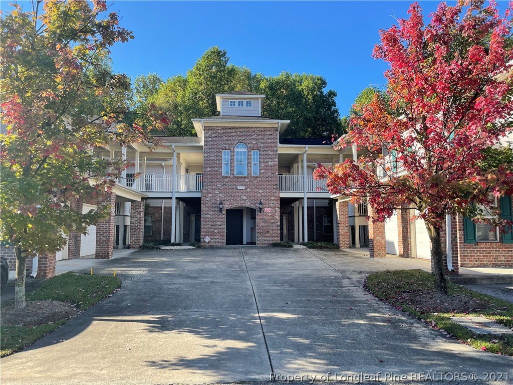 517 Lionshead Road, Unit 4 Fayetteville, NC 28311 - Photo 1 of 19 a front view of a house with yard and trees