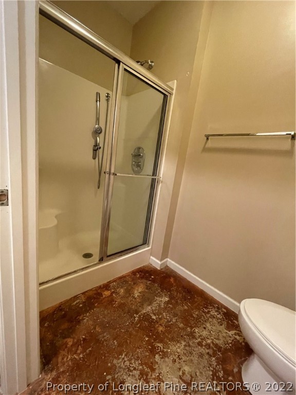 517 Lionshead Road, Unit 4 Fayetteville, NC 28311 - Photo 11 of 19 a bathroom with a shower and toilet