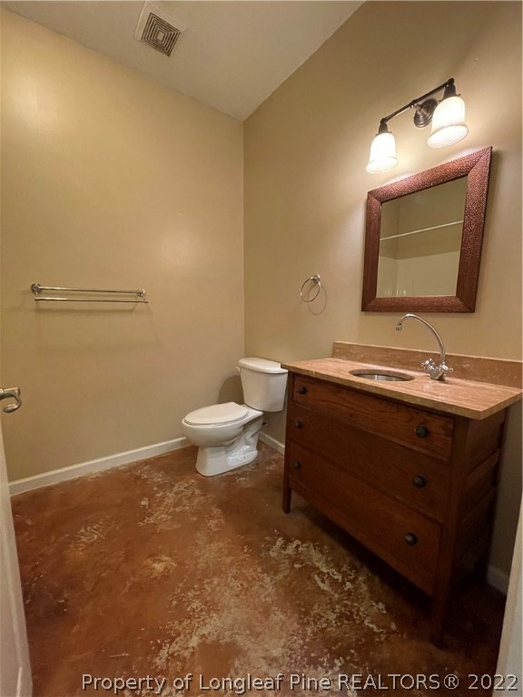 517 Lionshead Road, Unit 4 Fayetteville, NC 28311 - Photo 14 of 19 a bathroom with a sink toilet and mirror