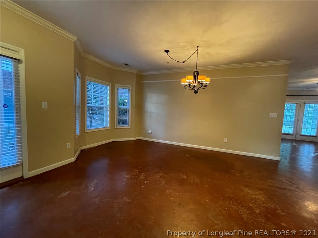 517 Lionshead Road, Unit 4 Fayetteville, NC 28311 - Photo 2 of 19 an empty room with wooden floor and windows