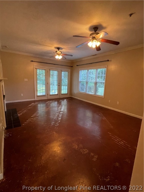 517 Lionshead Road, Unit 4 Fayetteville, NC 28311 - Photo 3 of 19 a view of an empty room with chandelier fan and fire place