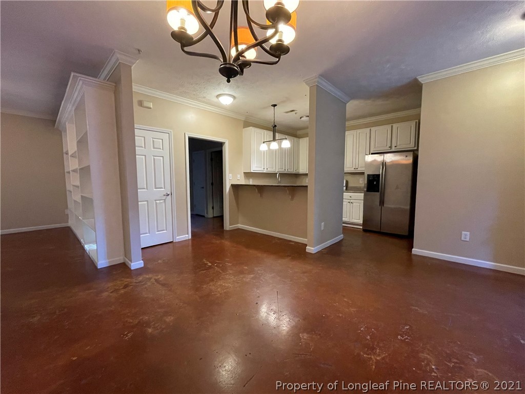 517 Lionshead Road, Unit 4 Fayetteville, NC 28311 - Photo 5 of 19 a view of a kitchen with a sink and a refrigerator