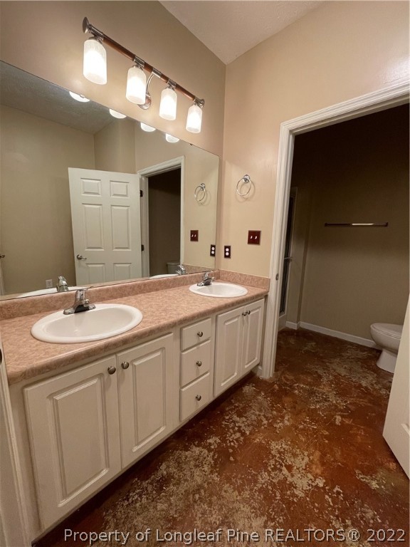 517 Lionshead Road, Unit 4 Fayetteville, NC 28311 - Photo 10 of 19 a bathroom with a sink and a mirror