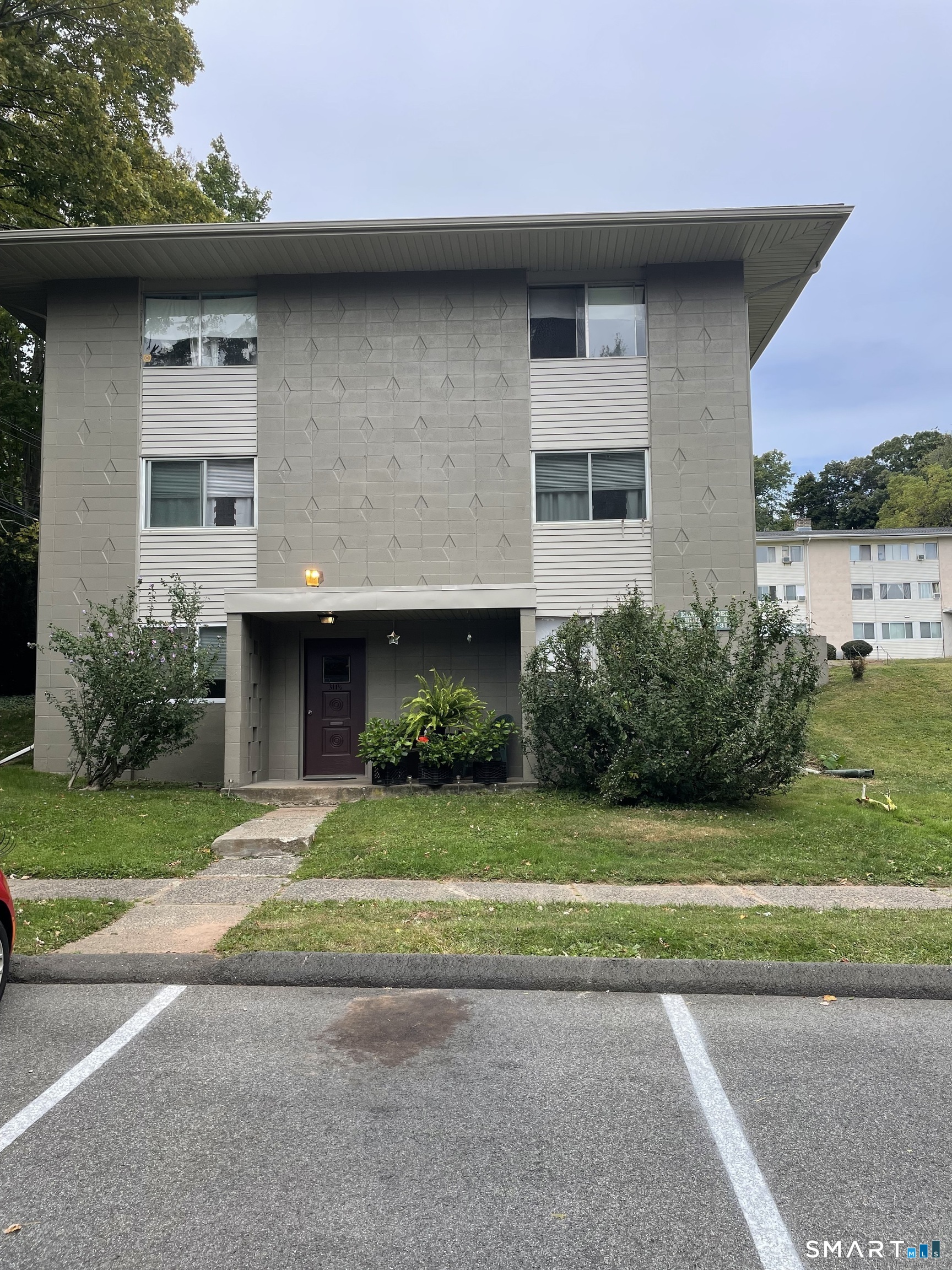 311 South Elm Street, Unit A Wallingford, CT 06492 - Photo 1 of 1 a front view of a house with a yard