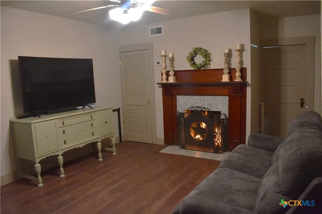 a living room with furniture and a fireplace