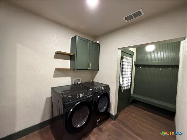 a utility room with dryer and washer