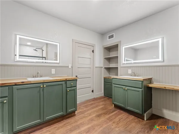 a kitchen with a sink and cabinets