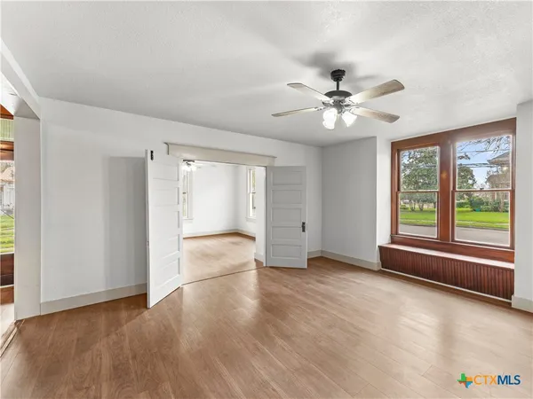 a view of an empty room with a window