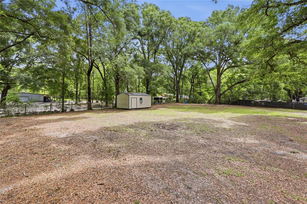 215 Southwest Alpine Place High Springs, FL 32643 - Photo 35 of 41 a view of a field with trees in the background