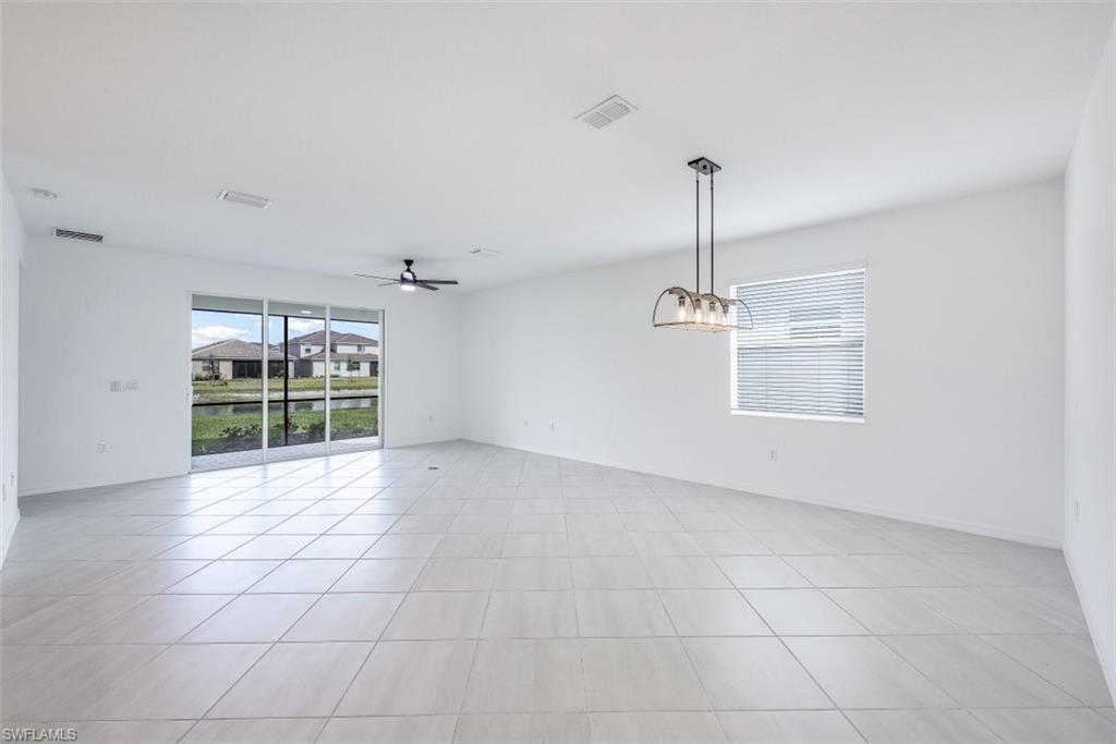 2434 Orchard Street Naples, FL 34120 - Photo 11 of 29 a view of an empty room with a window