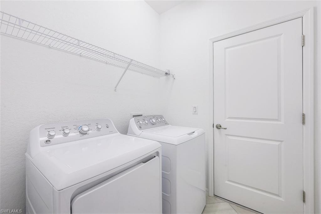 2434 Orchard Street Naples, FL 34120 - Photo 19 of 29 a utility room with dryer and washer