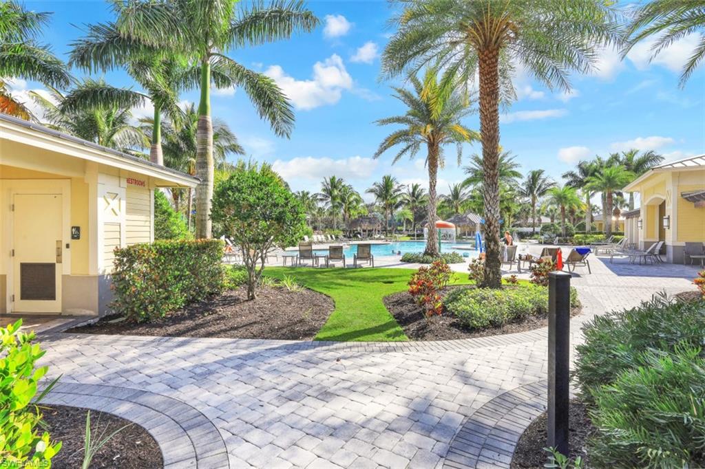 2434 Orchard Street Naples, FL 34120 - Photo 25 of 29 a view of a yard with palm trees