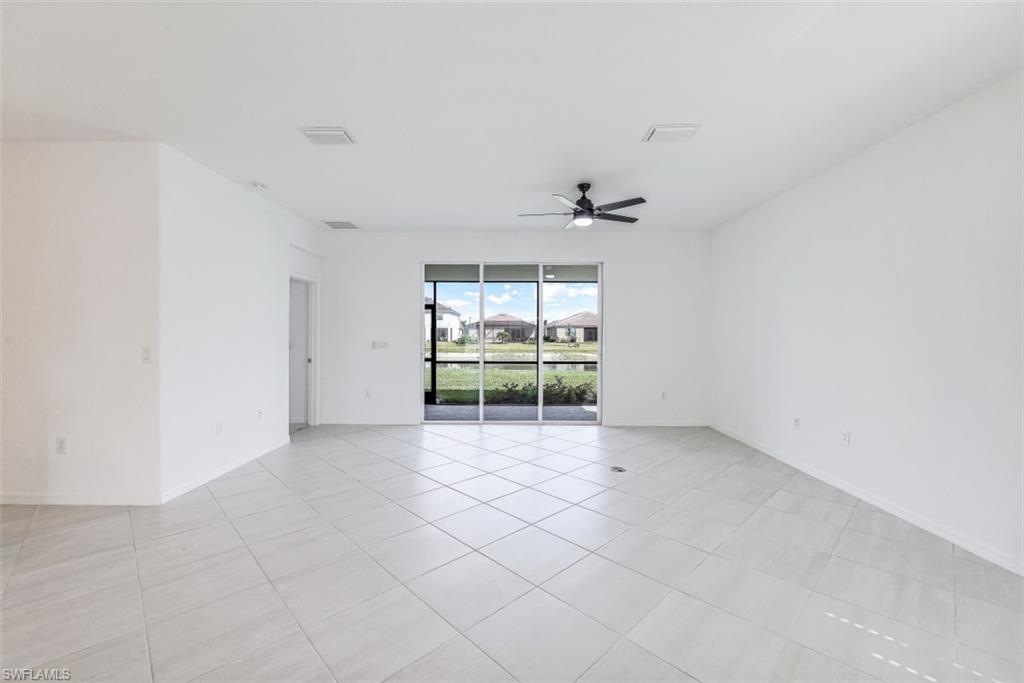 2434 Orchard Street Naples, FL 34120 - Photo 3 of 29 a view of an empty room with a window
