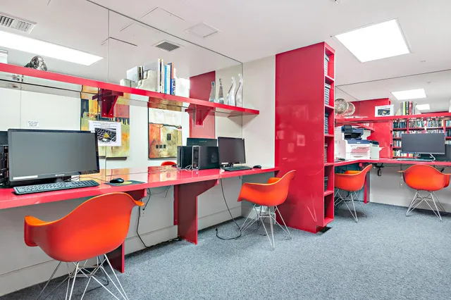 a outdoor space with pool table and chairs