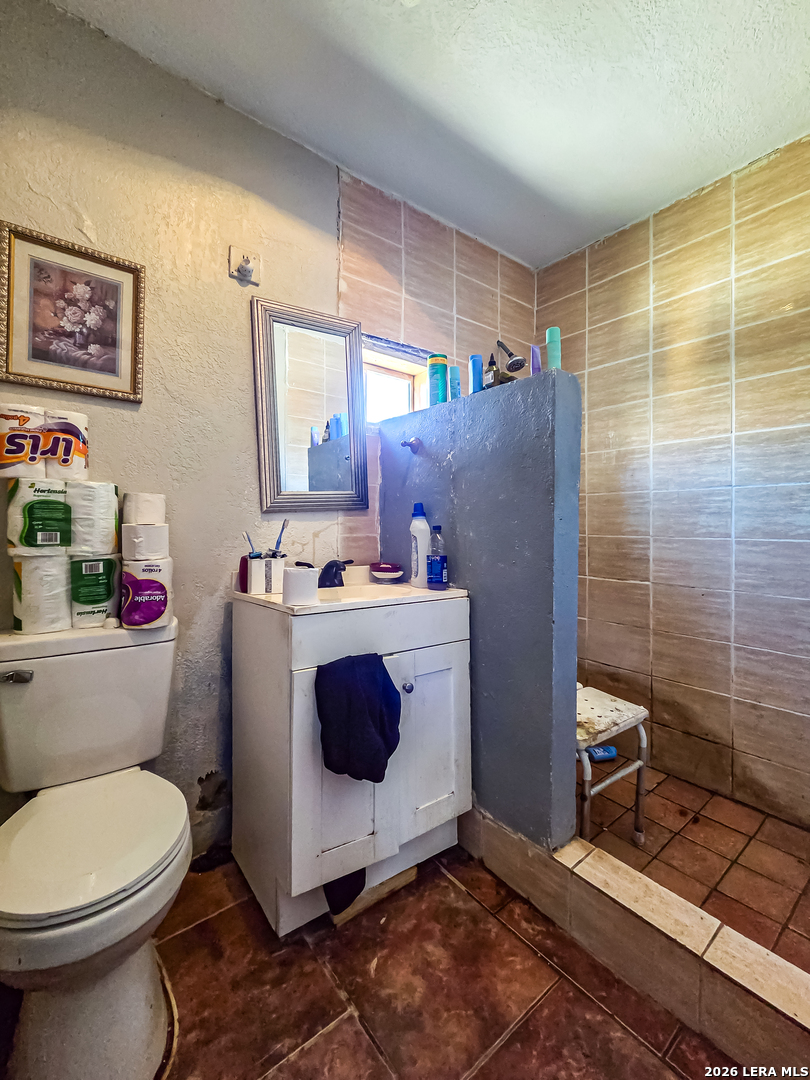 584 Chula Vista Road Eagle Pass, TX 78852 - Photo 14 of 17 a bathroom with a sink toilet and shower